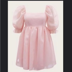 Light pink puffy sleeve dress hits at upper knee